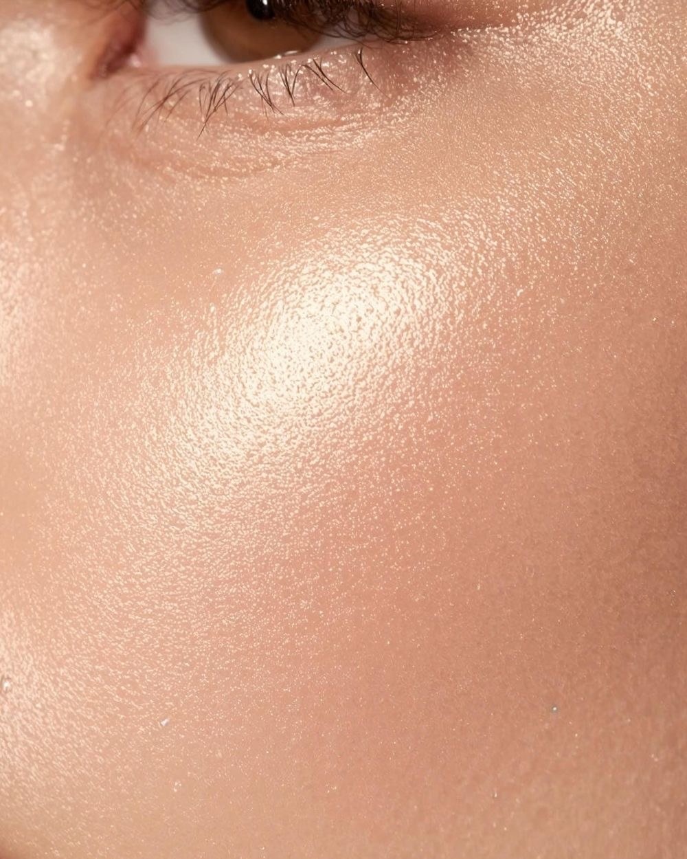 Close-up of a cheek with a dewy highlight